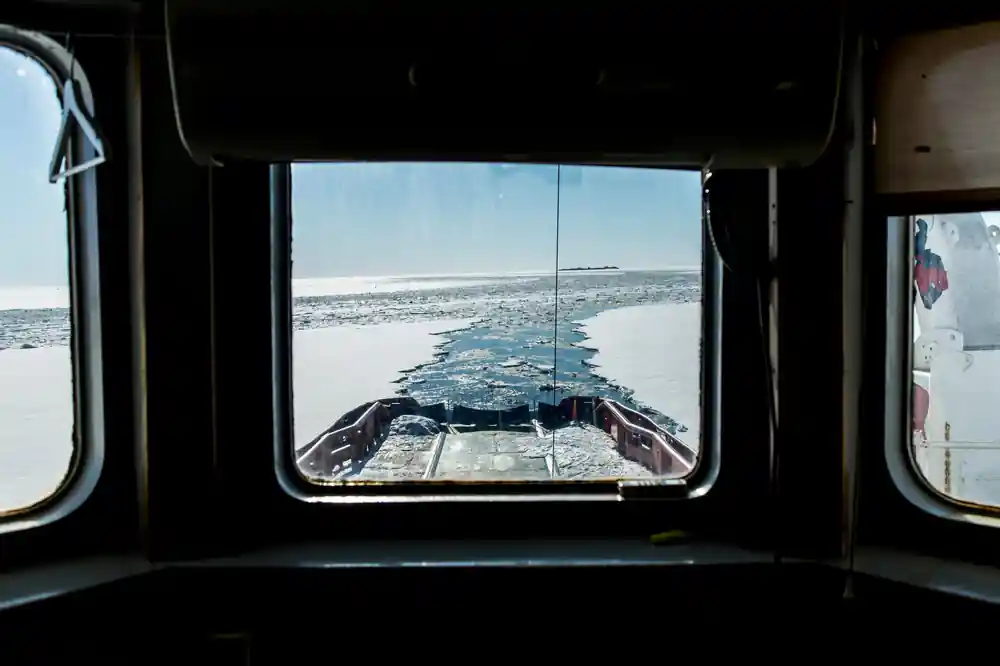 The broken channel astern seen through a window of the ship