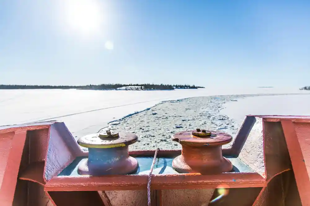 Deck bollards in the foreground with the frozen bay and islands beyond